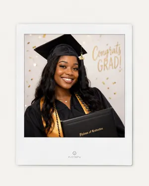 Graduate smiling in a framed graduation portrait keepsake.